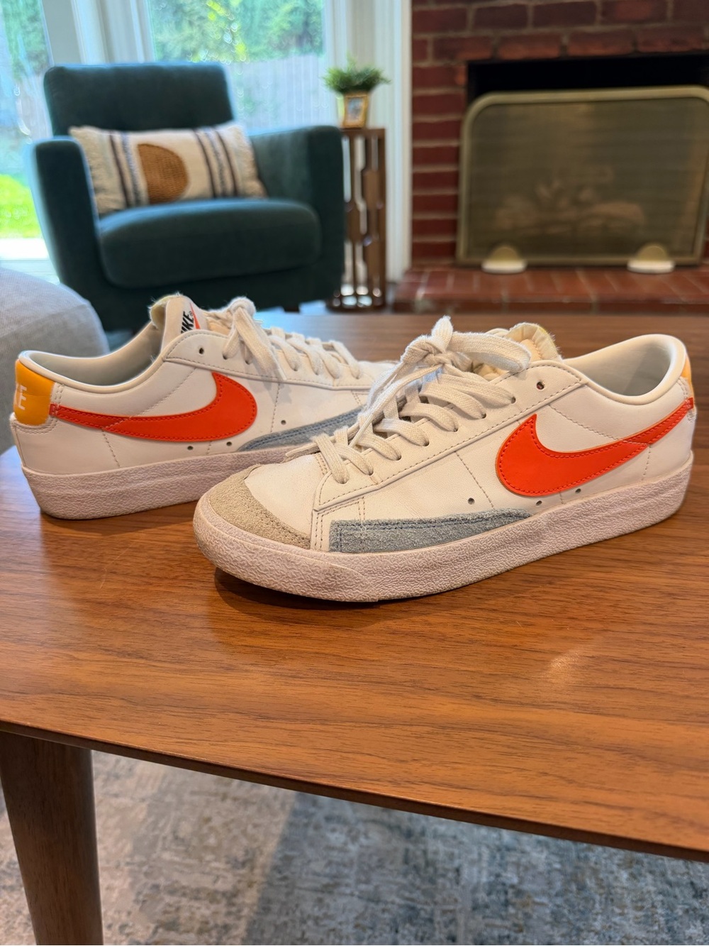 Nike White Low-Top Sneakers with Orange Swoosh